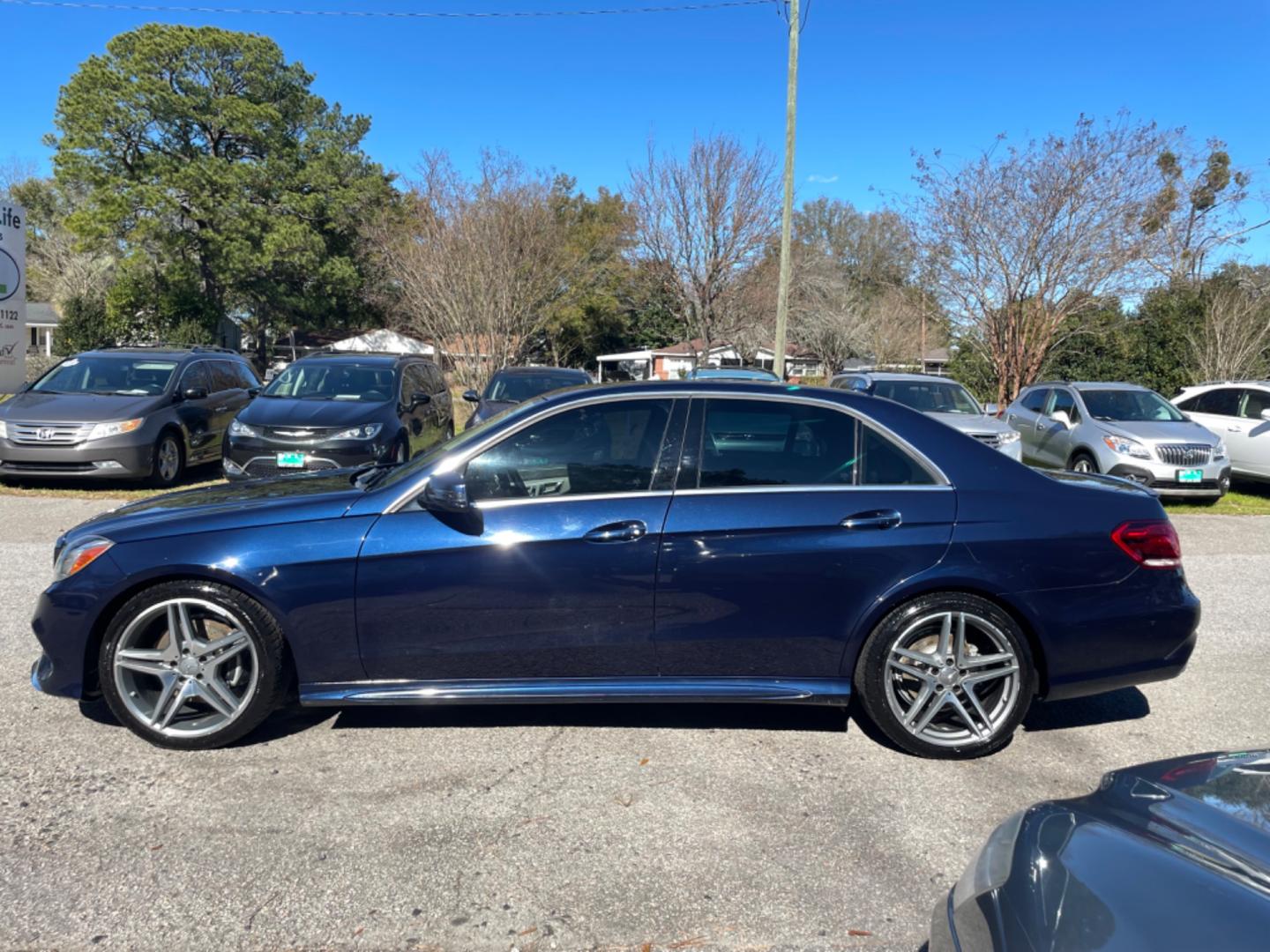 2014 BLUE MERCEDES-BENZ E-CLASS E 350 LUXURY 4MATIC (WDDHF8JB1EB) with an 3.5L engine, Automatic transmission, located at 5103 Dorchester Rd., Charleston, SC, 29418-5607, (843) 767-1122, 36.245171, -115.228050 - Beautiful & Clean Interior with Leather, Sunroof, Navigation, Backup Camera, Push button start, CD/AUX/Sat/Bluetooth, Dual Climate Control, Power Everything (windows, locks, seats, mirrors), Power Rear Sunshade, Heated/Memory Seating, Keyless Entry, Alloy Wheels. Clean CarFax (no accidents reported! - Photo#3